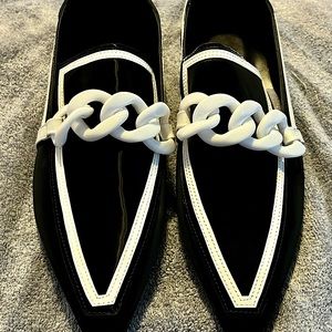 Black trimmed in white stylish, unique, flat style loafers